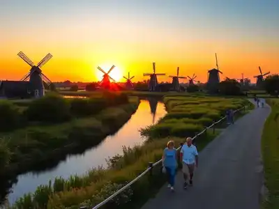 Windmills and sunset in Kinderdijk, a serene landscape.