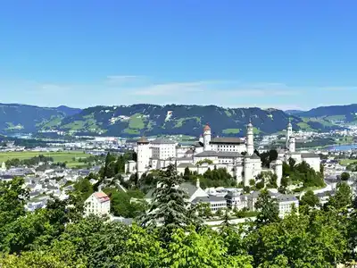 Scenic Salzburg skyline with fortress and river.