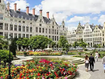 Couples walking in the Grand Place, Brussels.