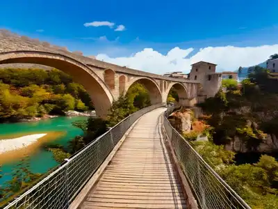 The Stari Most Bridge with a wooden footbridge running along side