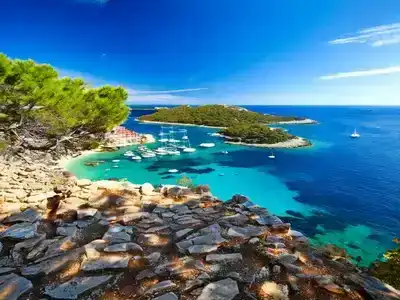 Elderly couples relaxing on a tranquil beach in Hvar.