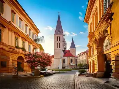 Street in Zagreb with a church at the end