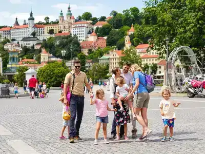 Family exploring attractions in Prague with joy and laughter.