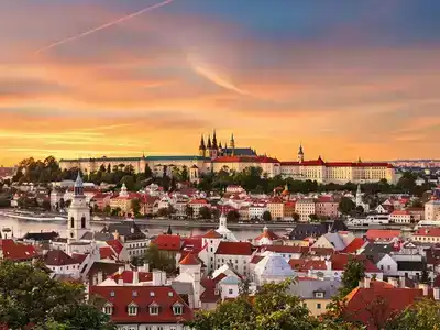 Scenic view of Prague’s historic skyline at sunset.