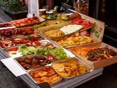 A stall with trays of street food on Aarhus Street 