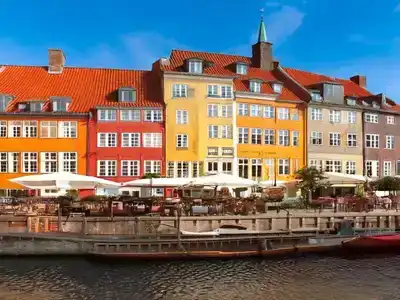 Colorful Nyhavn waterfront townhouses with open air coffee shop