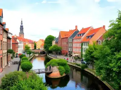 Colorful canals and historic buildings in Randers, Denmark.