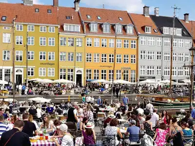 Couples and families enjoying Nyhavn in Copenhagen.