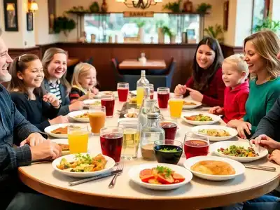 Family dining table with vibrant dishes and happy patrons.