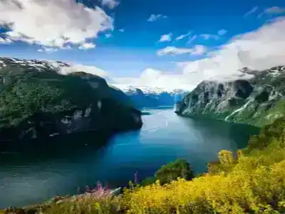 Norwegian fjord with snow capped mountains