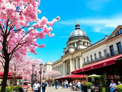 Springtime in Berlin with cherry blossoms and historic buildings.