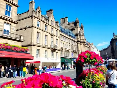 Summer scene in Edinburgh with vibrant architecture and performers.