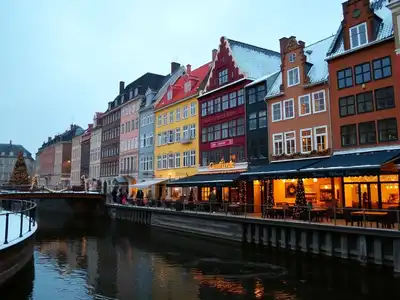 Winter scene of Copenhagen with festive lights and snow.