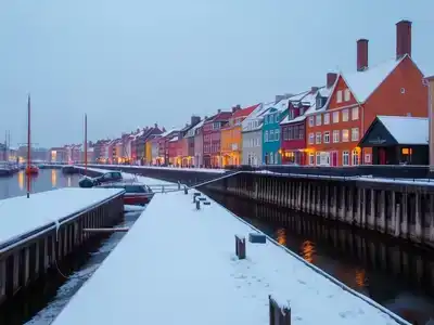 Winter scene of colorful Copenhagen houses by the water.