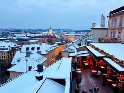 Snowy Helsinki street with cozy cafes in November.