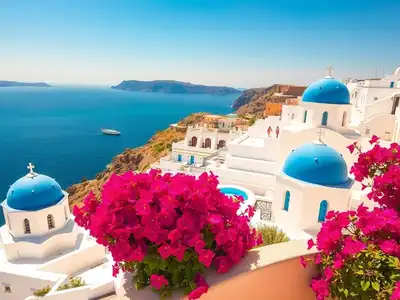 White buildings with blue domes overlooking the Aegean Sea.