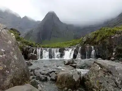 Fairy Pools in Scotland set in mountains and a misty background