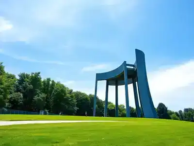 Sibelius Monument surrounded by trees and blue sky.