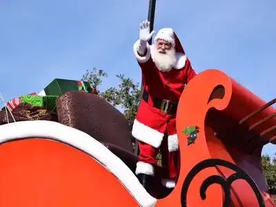 Santa standing on a large sleigh