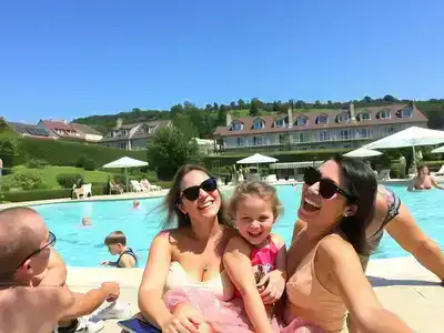 Family enjoying a sunny day at a French resort.