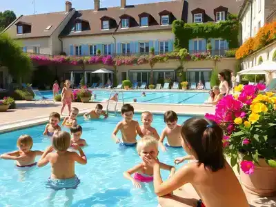 Family enjoying a resort pool under sunny skies in France.