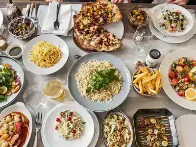 A table filled with traditional Lyonnaise cuisine.