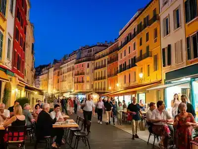 Couples and families enjoying nightlife in vibrant Nice.