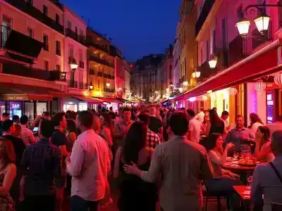 Couples enjoying nightlife in a vibrant Nice street.