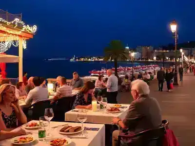 Couples and families dining by the seaside in Nice.