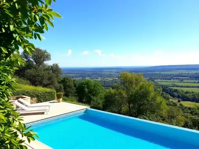 Beautiful infinity pool with scenic French landscape view.