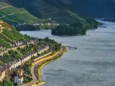 Row of houses running alongside the Rhine Valley river