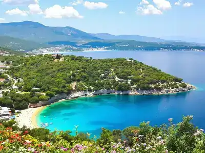 Scenic landscape of Corfu with beaches and hills.