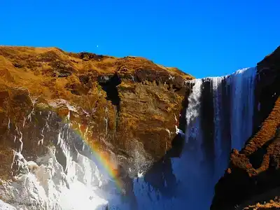 Skogafoss waterfall with rainbow