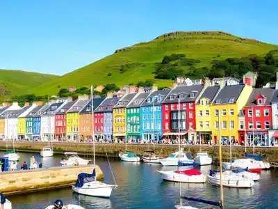 Colorful buildings and boats in Dingle harbor.