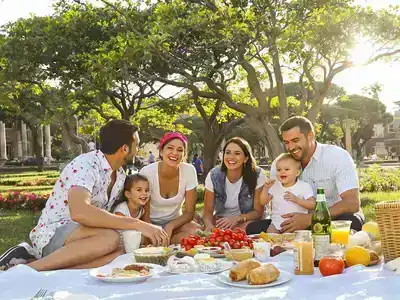 Family enjoying a picnic in a Roman park.