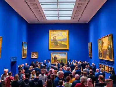 Interior view of the Van Gogh Museum with visitors.