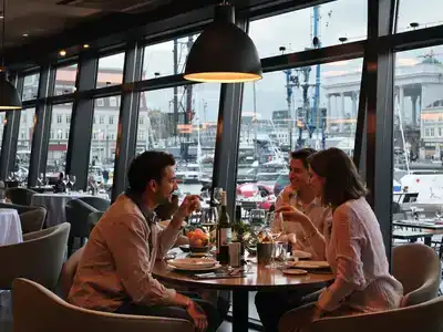 Couples dining in a cozy Rotterdam restaurant setting.