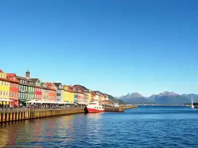 Colorful wooden buildings and harbor view in Bryggen.