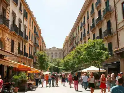 Sunny Barcelona street with traditional architecture and lively public squares.