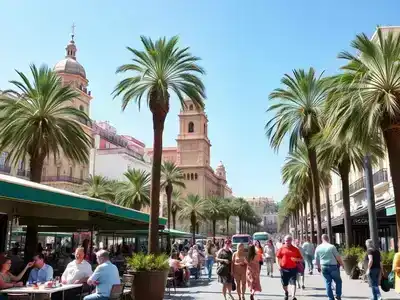 Vibrant Málaga streets with couples and families enjoying life.