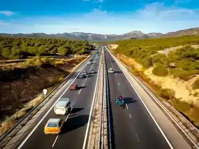 Diverse travelers using accessible transport in scenic Spain.