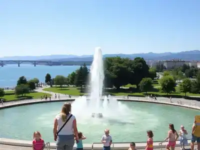 Families enjoying Geneva’s Jet d’Eau fountain in summer.