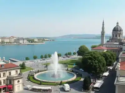 Scenic view of Geneva with historic architecture and lake.