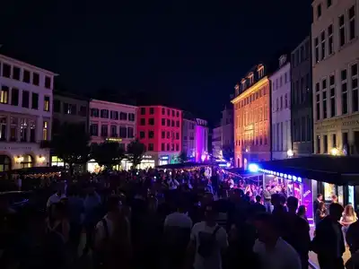 Zurich nightlife with vibrant lights and lively streets.