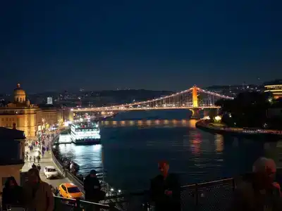 Istanbul nighttime skyline with glowing streets, bridges, and detailed architecture.