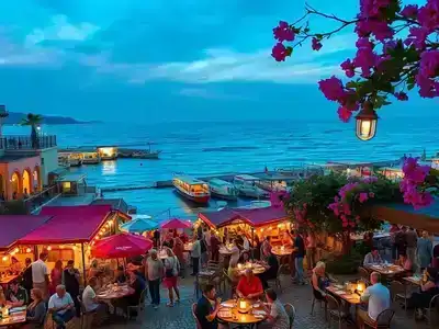 Dusky Antalya harbor with lively cafes and colorful Mediterranean architecture.