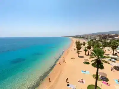 Family enjoying a beach day at a Turkish resort.