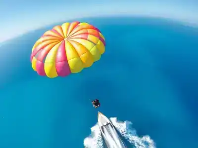 Colorful parasailing over beautiful turquoise waters in Turkey.