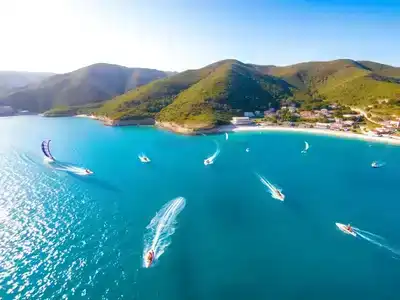 Colorful water sports scene on a Turkish coastline.