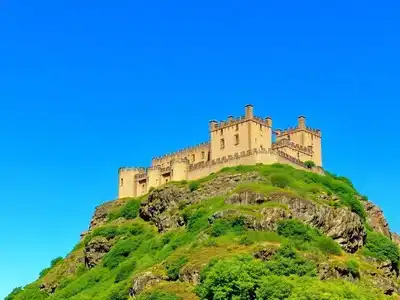 Edinburgh Castle on a sunny day with blue sky.